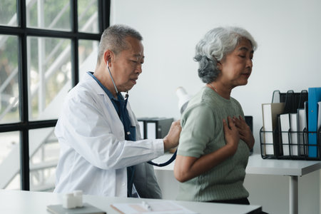 Doctor examining an elderly patient, An elderly patient is being diagnosed by a doctor in the hospital, The doctor is explaining the treatment plan to the patient, doctor idea.の写真素材