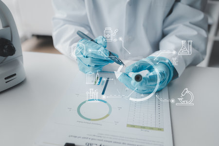 Chemist taking notes on research data, Scientist is working in the laboratory, Chemist is analyzing experimental results and taking notes in the laboratory, lab idea.の写真素材