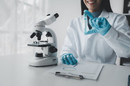 Chemist is chemically analyzing test tubes, Scientist is experimenting with chemicals in the laboratory, Chemist is separating compounds in test tubes with chemical reagents.の写真素材