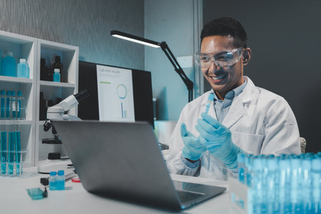 Chemist is chemically analyzing test tubes, Scientist is experimenting with chemicals in the laboratory, Chemist is separating compounds in test tubes with chemical reagents.の写真素材