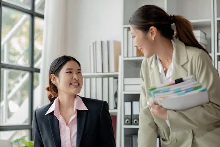 Explaining the report at the meeting, Collaborate to solve problems in the meeting room, Discuss startup business with the team at the office, Work together as a team,の写真素材