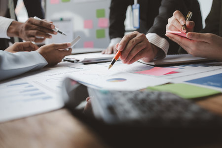 Team of analyst working on financial data analysis dashboard on paper as marketing indication for business strategic planning, Insight, They are calculating the taxes they have to pay,の写真素材