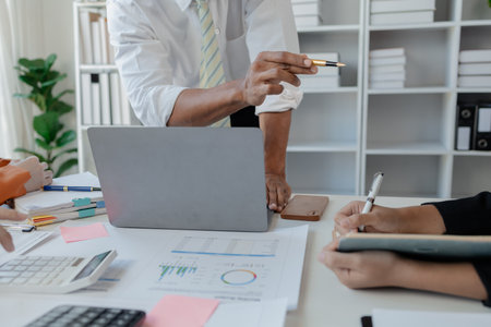 Business people talking in the conference room, A group of startup businessmen are planning a company, Do activities together in the company to discuss how to solve problems.の写真素材