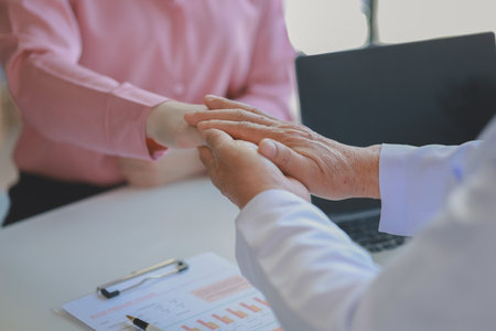 The doctor is giving advice and recommending health care methods to the patient in a friendly way, The doctor and the patient are discussing the process of future treatment.の写真素材