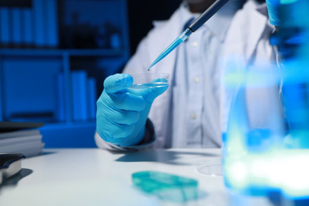 A chemist is testing a newly discovered chemical using a variety of scientific equipment in his lab,...