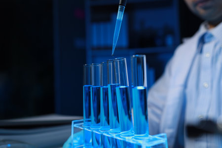 A chemist is testing a newly discovered chemical using a variety of scientific equipment in his lab,...