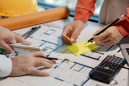 Engineer and architect work together in the office of a construction company, Architect and...