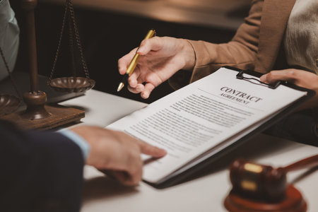 A group of lawyers and clients are discussing the contract they will be signing together in the future, Collaborative brainstorming between lawyers and clientsの写真素材