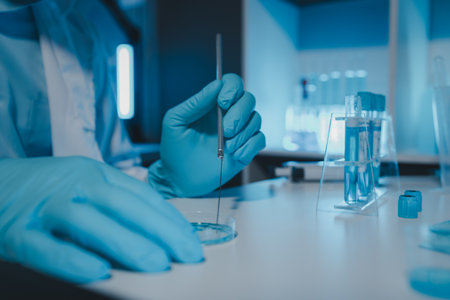 a scientist is working in a laboratory, a chemical researcher is preparing sample for a vaccine...