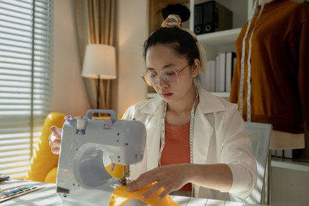 A gorgeous new face designer is using her little sewing machine to sew fabric to look stylish...