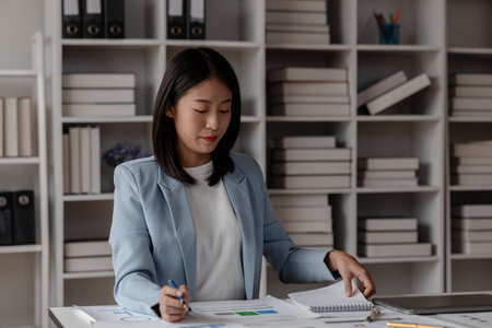 atmosphere in the office in day time, working in company as an employee, various work activities that occur in the office during working hours, wearing a suit to work is a polite way to dressの写真素材