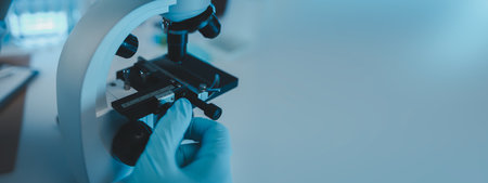 a scientist uses a microscope to look for contaminants in a test sample, a researcher uses a...