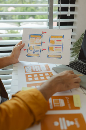 A digital product developer is working on a plan to work with research data to guide the development of a website that is as effective as possible for users, while also being visually appealingの写真素材