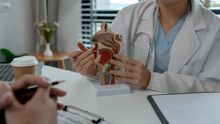 two ENT specialists are discussing the most appropriate treatment for a patient, the two doctors are...