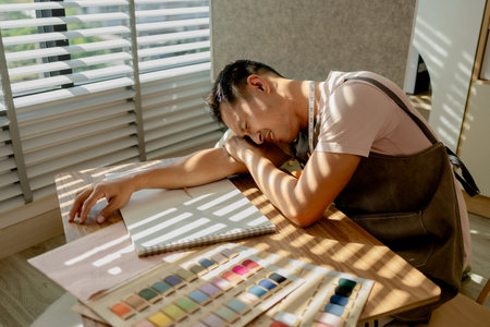 a fashion designer is under a lot of stress because he cannot figure out what his new collection...