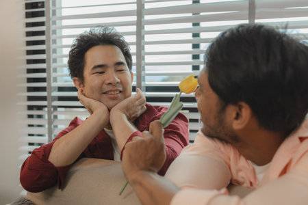 male couple is very loving towards each other which shows through their actions, lovers willingly do romantic things for each other, relationship is filled with laughter because they are very happyの写真素材