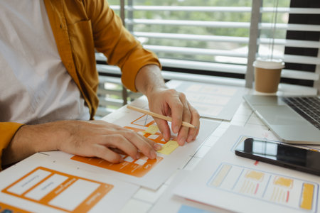 A digital product developer is working on a plan to work with research data to guide the development of a website that is as effective as possible for users, while also being visually appealingの写真素材