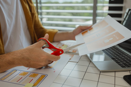 A digital product developer is working on a plan to work with research data to guide the development of a website that is as effective as possible for users, while also being visually appealingの写真素材
