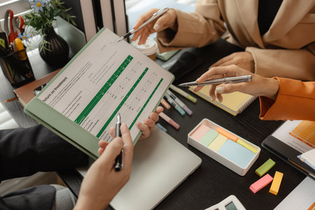Several employees work together in a company, A group of business people sit together and discuss and exchange ideas about the content of the work, colleagues planning together in the officeの写真素材