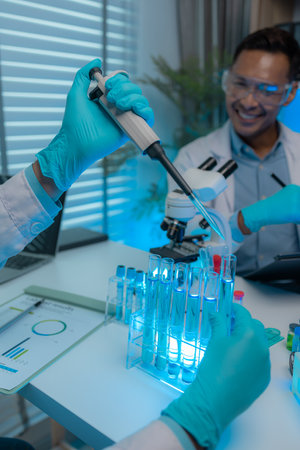 a scientist and his assistant are working together in the laboratory with a lot of science...