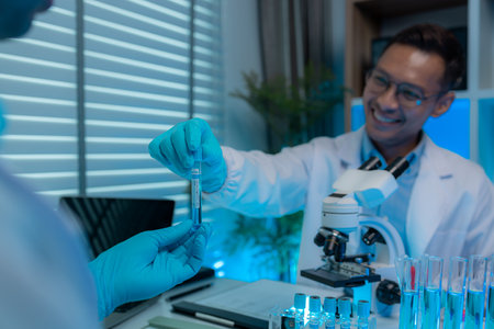a scientist and his assistant are working together in the laboratory with a lot of science...