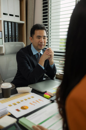 they are working on the new project together in the office, a lot of paperwork on the desk that this group of businessman have to working on, business meeting, workplace, businesspeopleの写真素材
