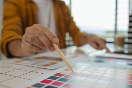 A web designer is using his idea to create a digital product design project that will meet the needs of users in terms of both appearance and feel when using it, ux, ui, interface, experience.の写真素材