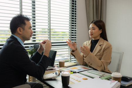 they are working on the new project together in the office, a lot of paperwork on the desk that this group of businessman have to working on, business meeting, workplace, businesspeopleの写真素材