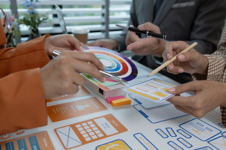 the development team is consulting on the design of the website UX UI, they are working on project...