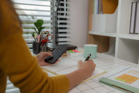 Candid portrait of employee staff member leader at the office workspace, confident young business woman on the background of the office, Professional business woman in modern officeの写真素材