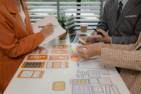 the development team is consulting on the design of the website UX UI, they are working on project...