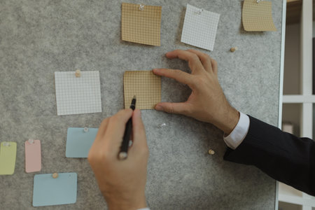 A businessman is presenting an earnings report to the board of directors with great attention. Data and documents are presented and explained in the meeting by a businessman.の写真素材