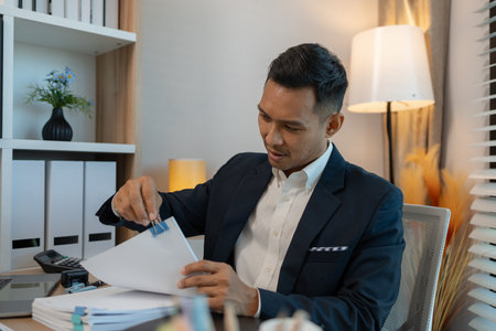 Image of handsome businessman is working in office, cheerful businessman entrepreneur professional...