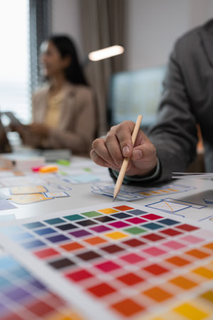 drawing website ux ui app for mobile phone application and development template layout, UI development, designer team working on a project of ux ui in creative office, team of creative webの写真素材