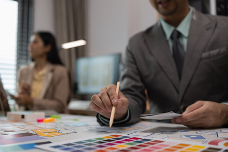 drawing website ux ui app for mobile phone application and development template layout, UI development, designer team working on a project of ux ui in creative office, team of creative webの写真素材