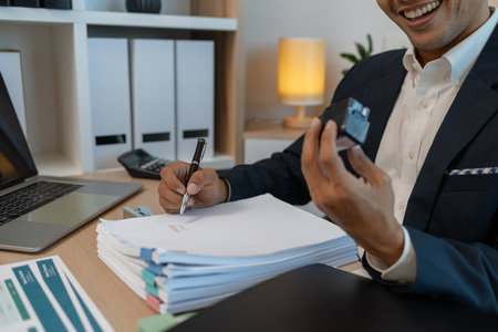Image of handsome businessman is working in office, cheerful businessman entrepreneur professional...