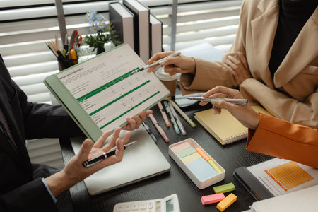 Several employees work together in a company, A group of business people sit together and discuss and exchange ideas about the content of the work, colleagues planning together in the officeの写真素材