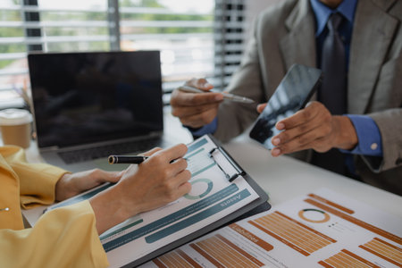 two busy professional executive team business people working together on business finances analysis at office meeting, professional manager consulting corporate clientの写真素材