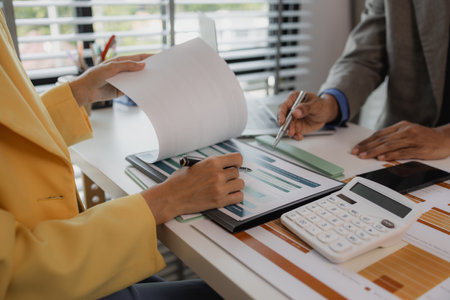 two busy professional executive team business people working together on business finances analysis at office meeting, professional manager consulting corporate clientの写真素材