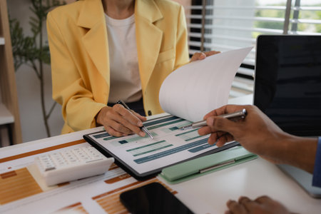 two busy professional executive team business people working together on business finances analysis at office meeting, professional manager consulting corporate clientの写真素材