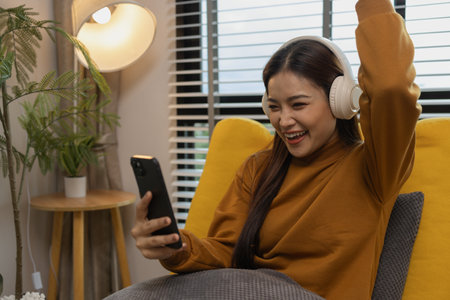 happy and comfortable at home in the morning, young woman relaxing at home, girl resting in her room, enjoy life, rest, relaxation, wellbeing, lifestyle,の写真素材