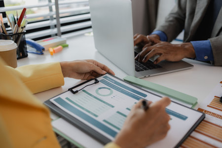 two busy professional executive team business people working together on business finances analysis at office meeting, professional manager consulting corporate clientの写真素材