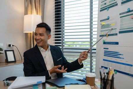 businessman giving presentation in office, an investor pitching to a room with charts and graphs showing the potential of renewable investments, presenting an accounting reportの写真素材
