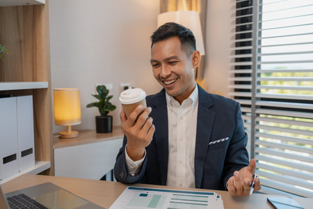 businessman in office relaxing in the office, calm businessman sit relax in his private office workplace take a break, happy relaxed young, man, Asian businessman is relaxing after finishing workの写真素材