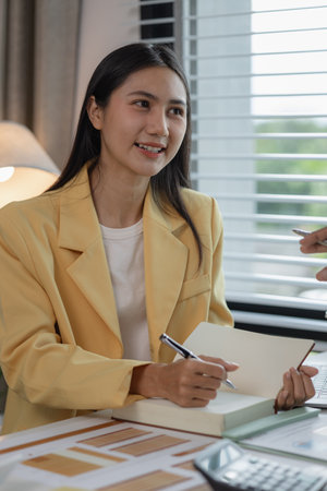 diverse team working together in modern co-working space, business people having casual discussion during meeting, marketing, accounting, finance, Team working ambitiously in an office room.の写真素材
