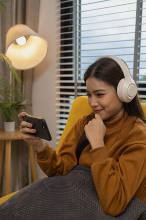 happy and comfortable at home in the morning, young woman relaxing at home, girl resting in her room, enjoy life, rest, relaxation, wellbeing, lifestyle,の写真素材