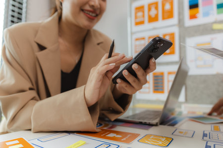 Web designers are working hard to design the appearance of digital products that are colorful, attractive, and user-friendly, while also not cumbersome for users to use.の写真素材