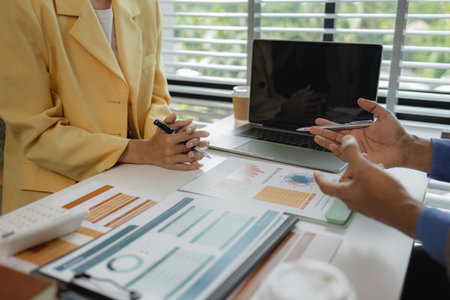 two busy professional executive team business people working together on business finances analysis at office meeting, professional manager consulting corporate clientの写真素材