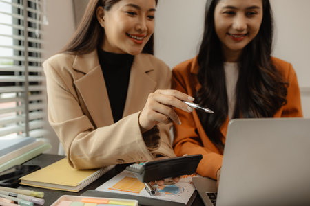 Several employees work together in a company, A group of business people sit together and discuss and exchange ideas about the content of the work, colleagues planning together in the officeの写真素材
