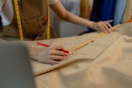 a beautiful tailor is working on her favorite craft in a studio filled with a variety of sewing...